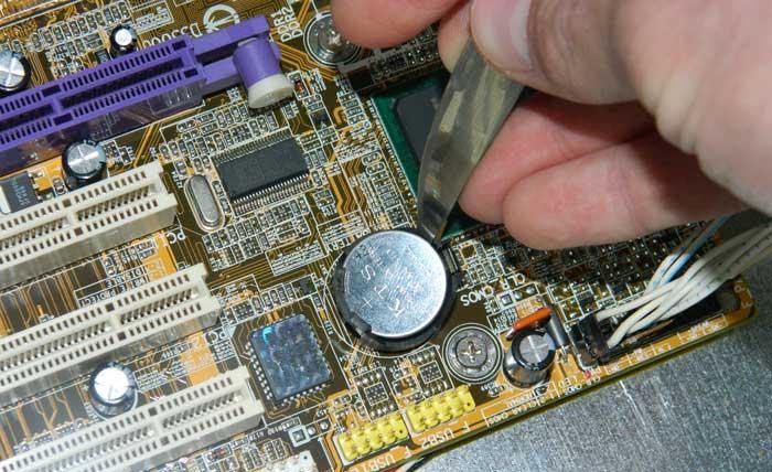 Figure 4: Removing the battery pocket from the motherboard.