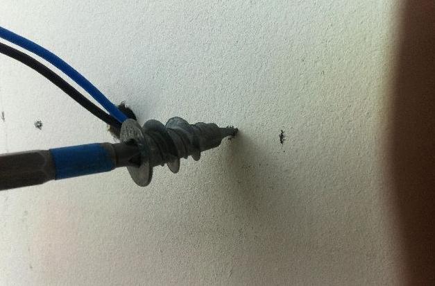 Screw the dowels with a screwdriver into the drywall.