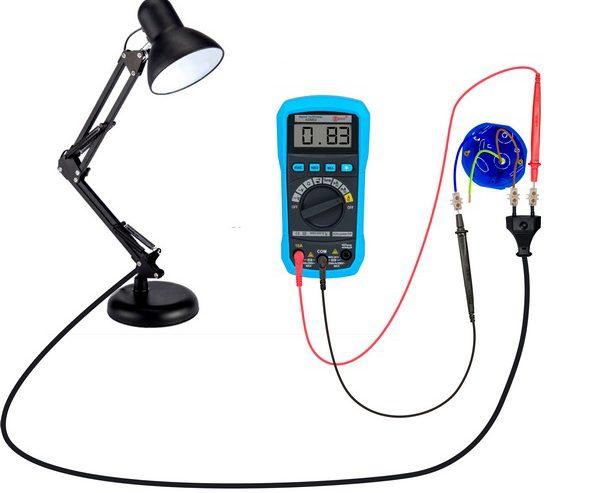 Checking a table lamp with a tester