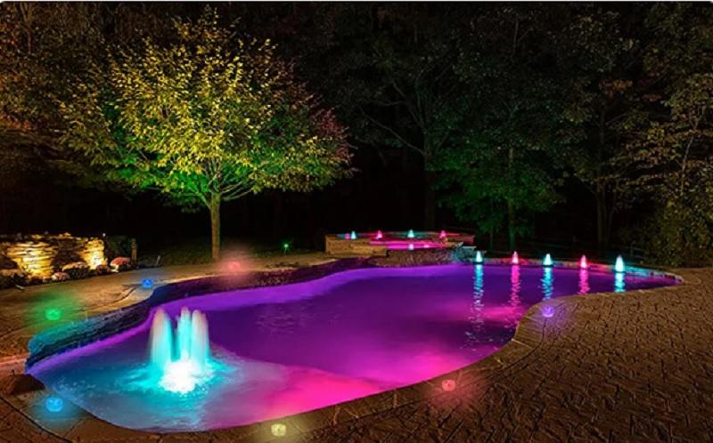 Multicolored lighting along with fountains.