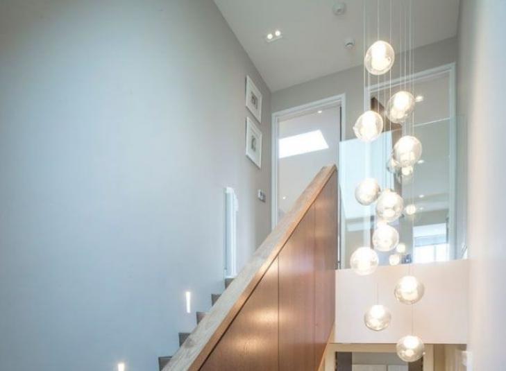 A chandelier is often used as one of the light sources.