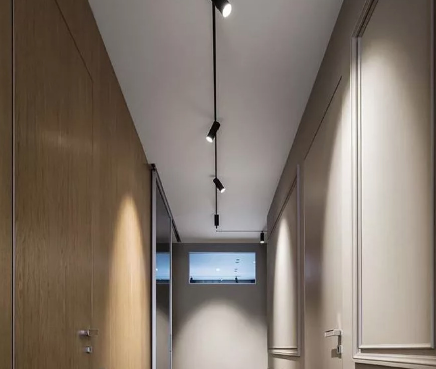 The track lighting system in the apartment interior