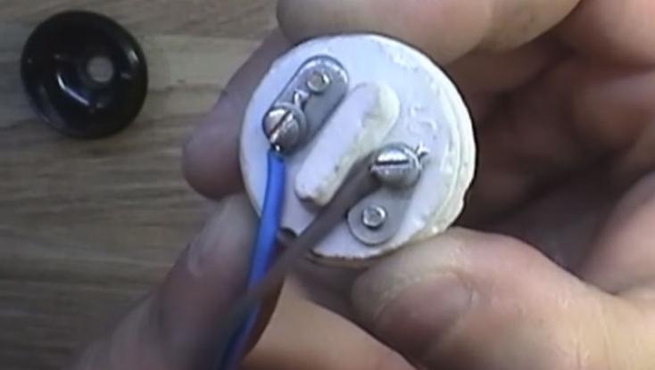 Replacing a socket in the lamp with his hands