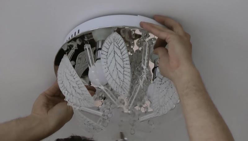 Chandelier installation on the suspended ceiling